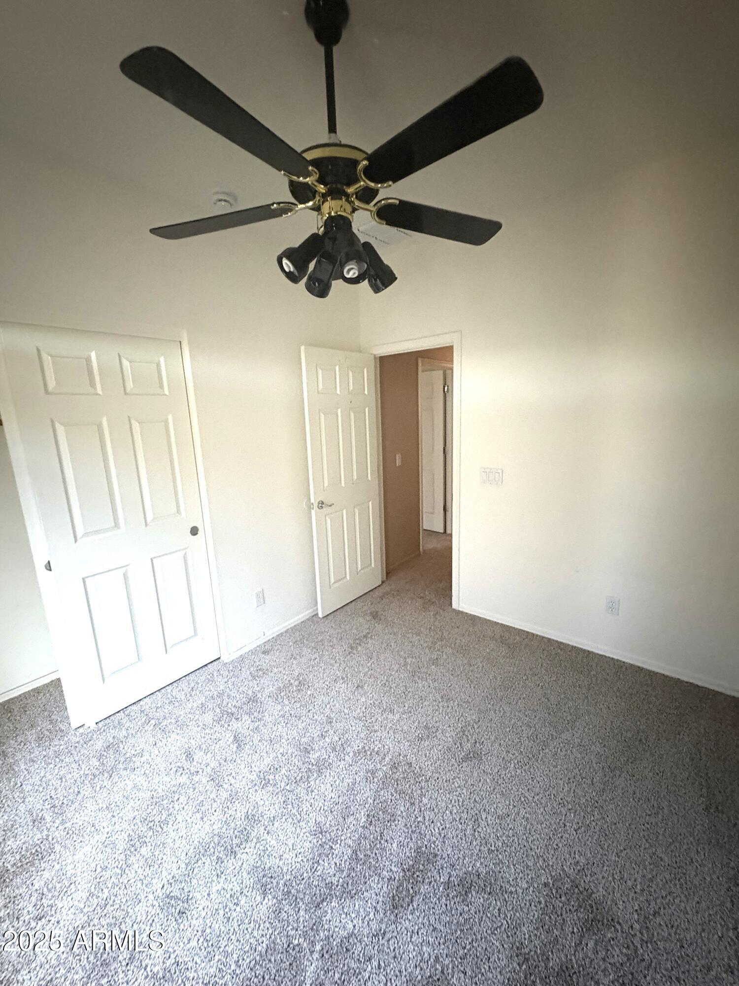 3057 East Pinto Valley Road San Tan Valley, AZ 85143 - Photo 13 of 17 en view interior of a house a ceiling fan and kitchen view