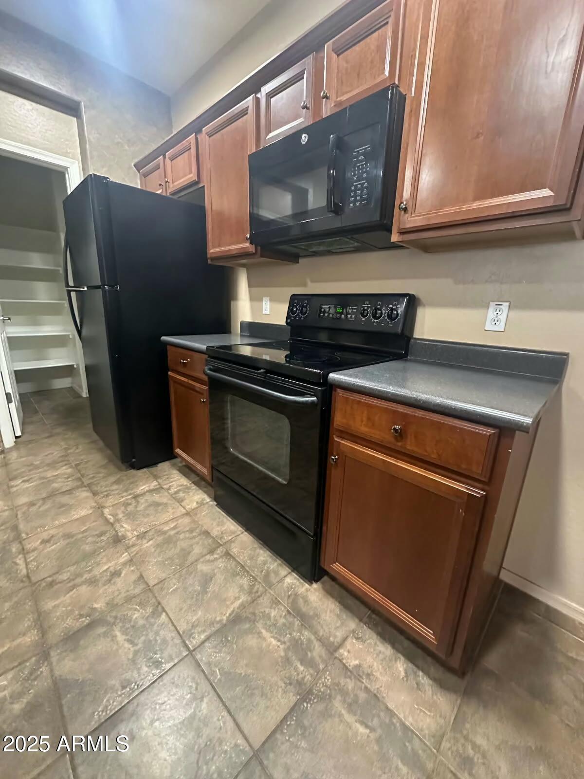 3057 East Pinto Valley Road San Tan Valley, AZ 85143 - Photo 2 of 17 a kitchen with stainless steel appliances granite countertop a stove a refrigerator and a sink