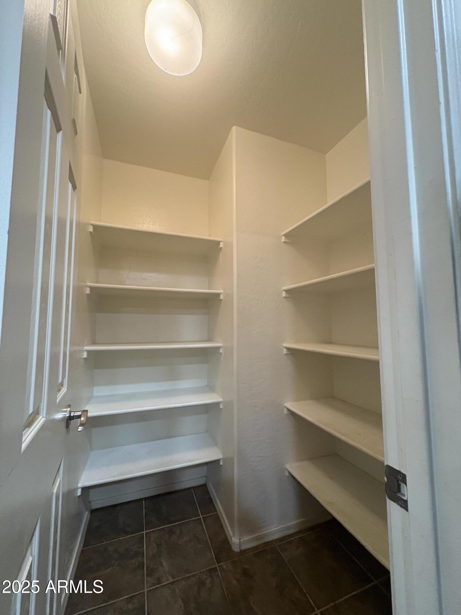 3057 East Pinto Valley Road San Tan Valley, AZ 85143 - Photo 4 of 17 a storage room with washer and dryer