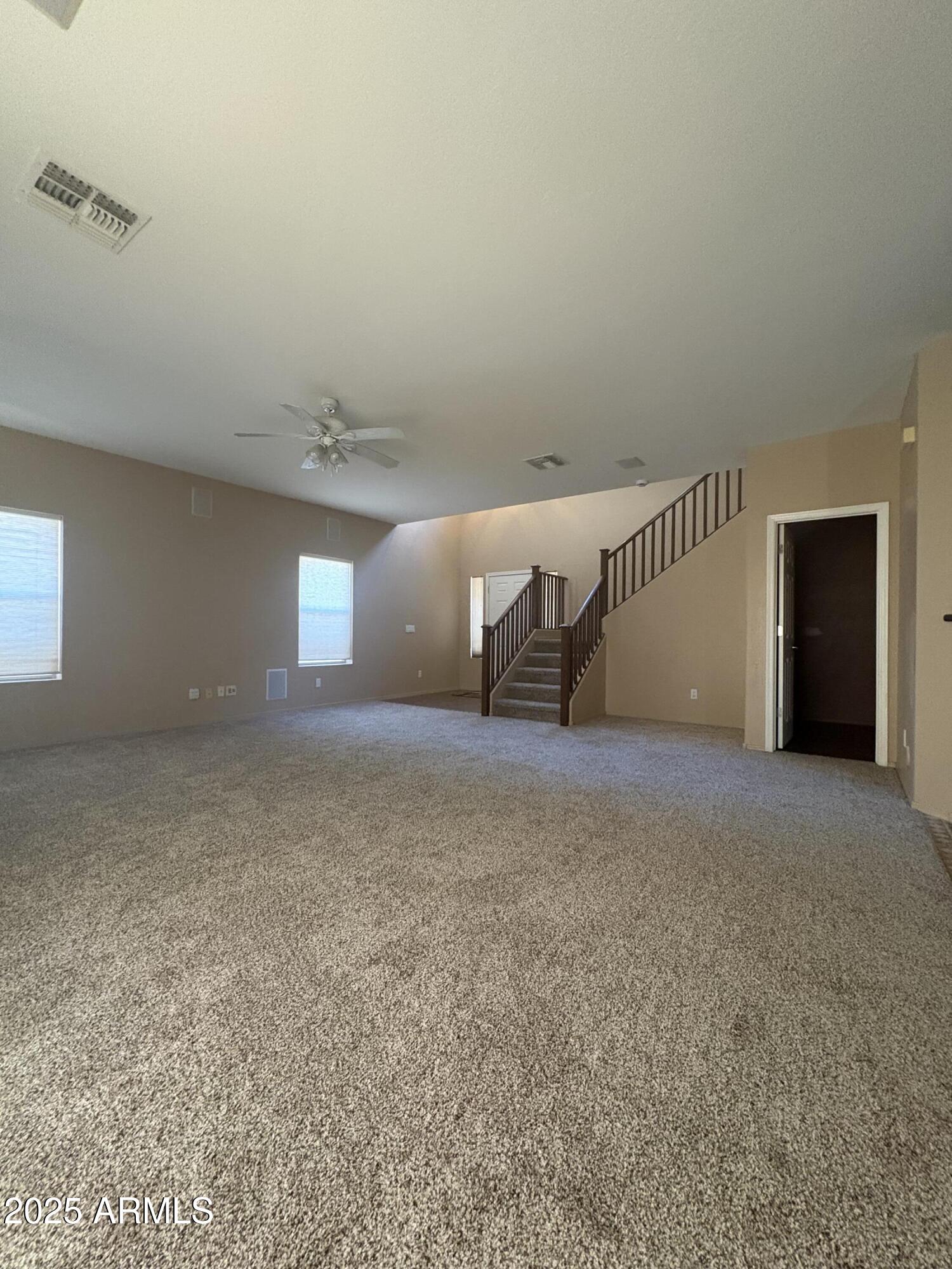 3057 East Pinto Valley Road San Tan Valley, AZ 85143 - Photo 7 of 17 a view of an empty room with windows