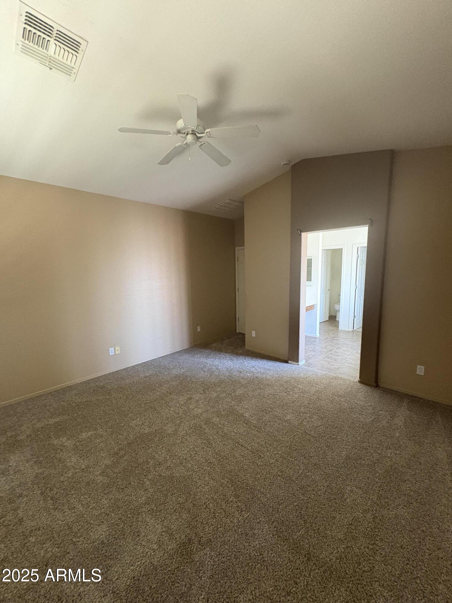 3057 East Pinto Valley Road San Tan Valley, AZ 85143 - Photo 9 of 17 a view of an empty room with a window