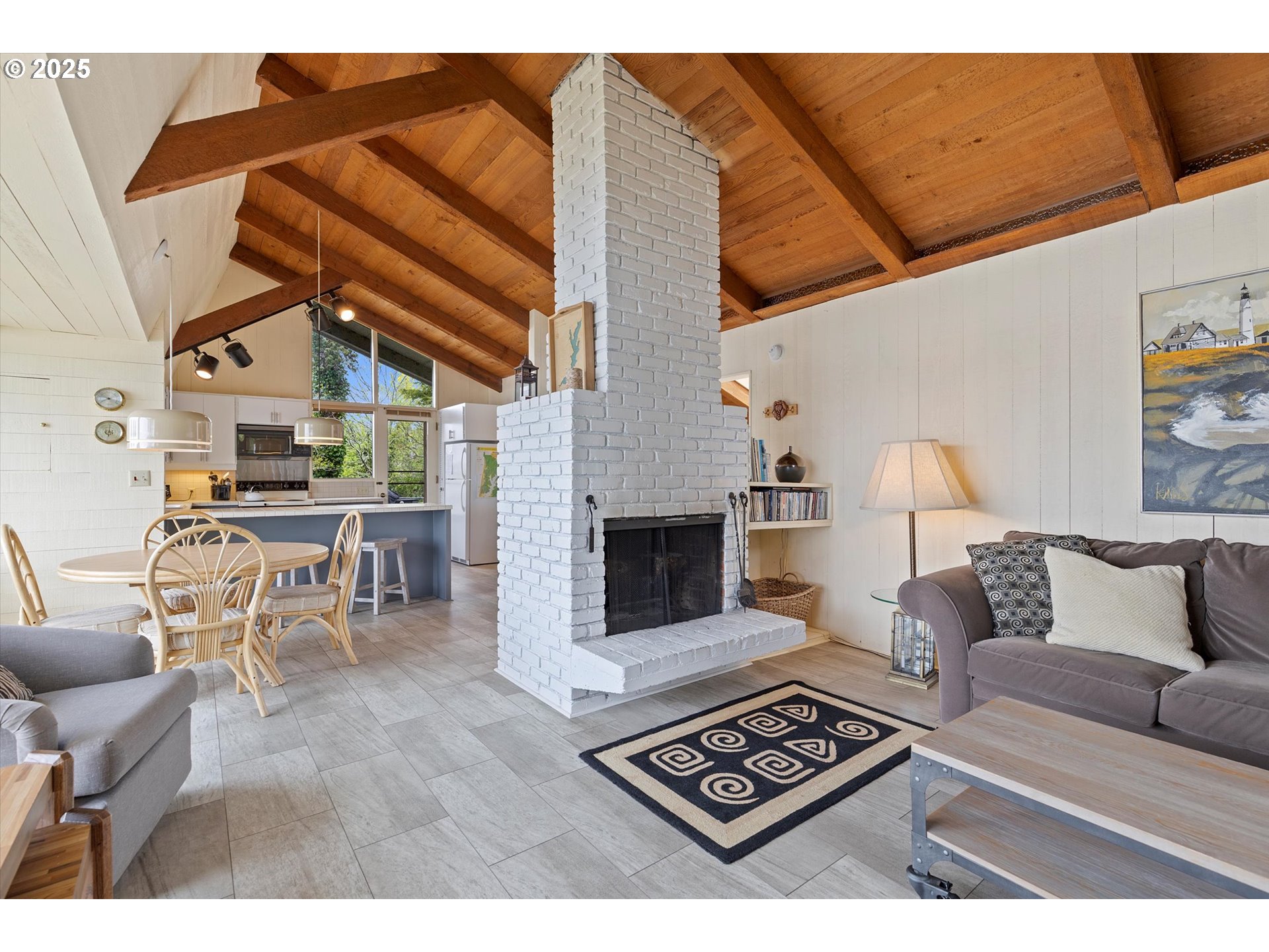 2871 Northeast East Devils Lake Road Otis, OR 97368 - Photo 17 of 48 a living room with furniture and a fireplace