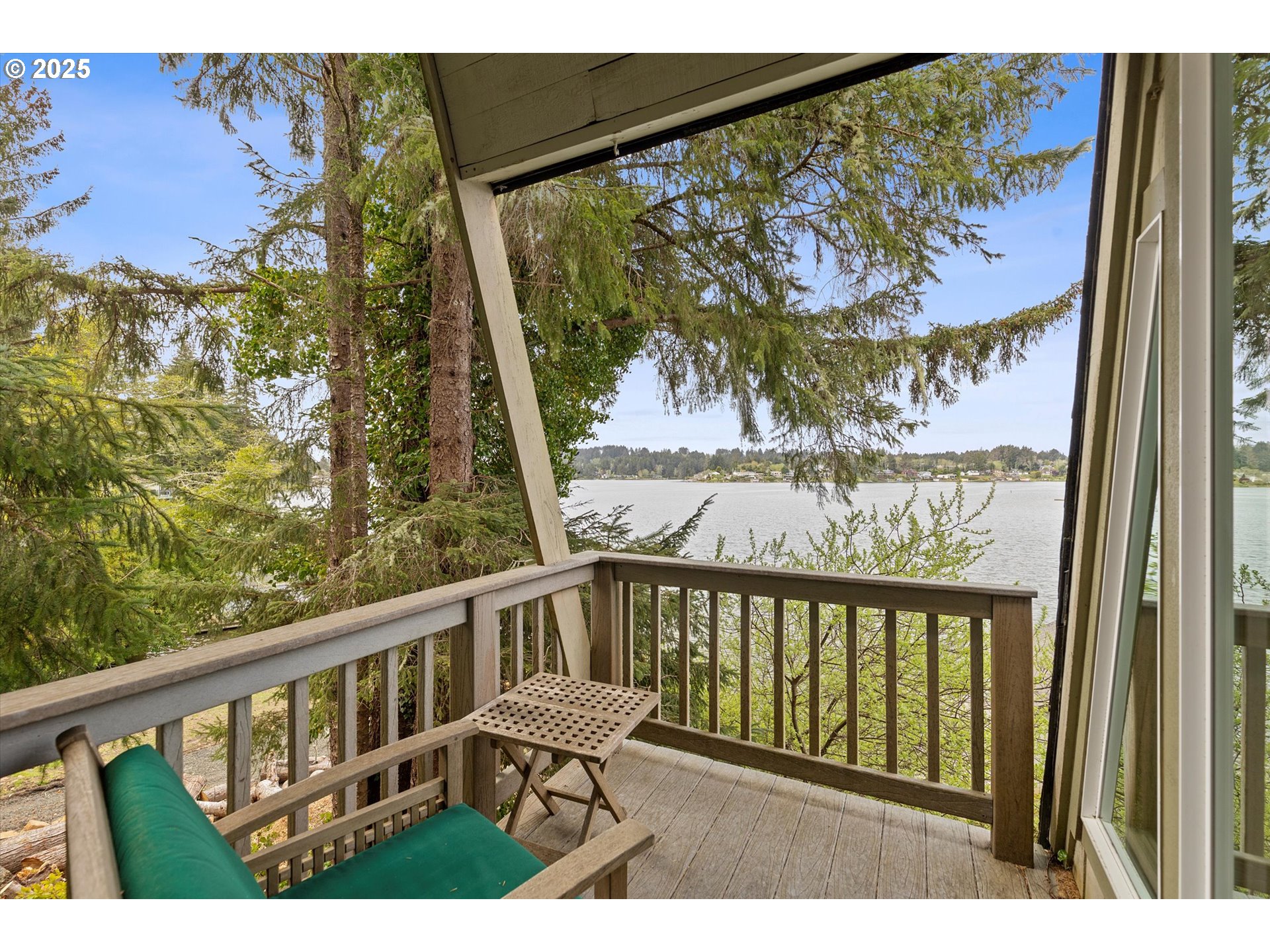 2871 Northeast East Devils Lake Road Otis, OR 97368 - Photo 19 of 48 a view of a balcony with wooden floor