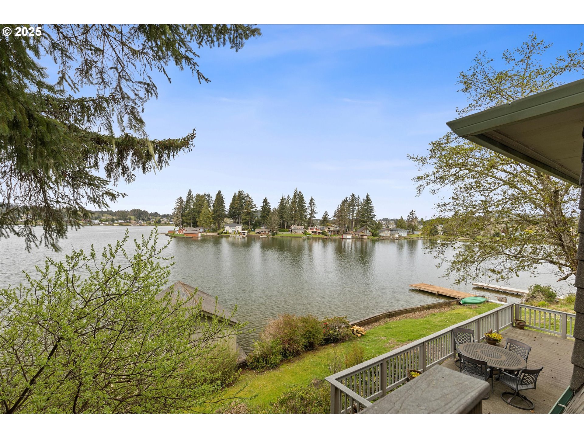 2871 Northeast East Devils Lake Road Otis, OR 97368 - Photo 20 of 48 a view of a lake with a outdoor space