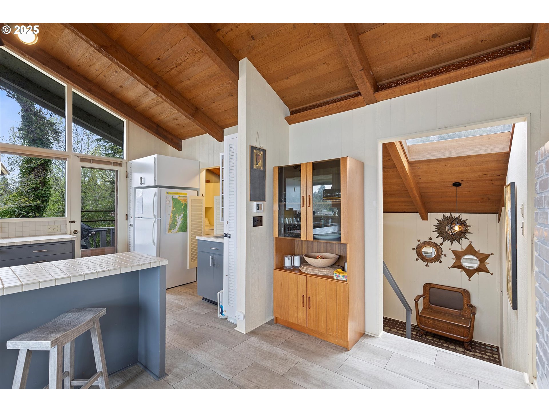 2871 Northeast East Devils Lake Road Otis, OR 97368 - Photo 21 of 48 a view of livingroom with furniture cabinet and front door