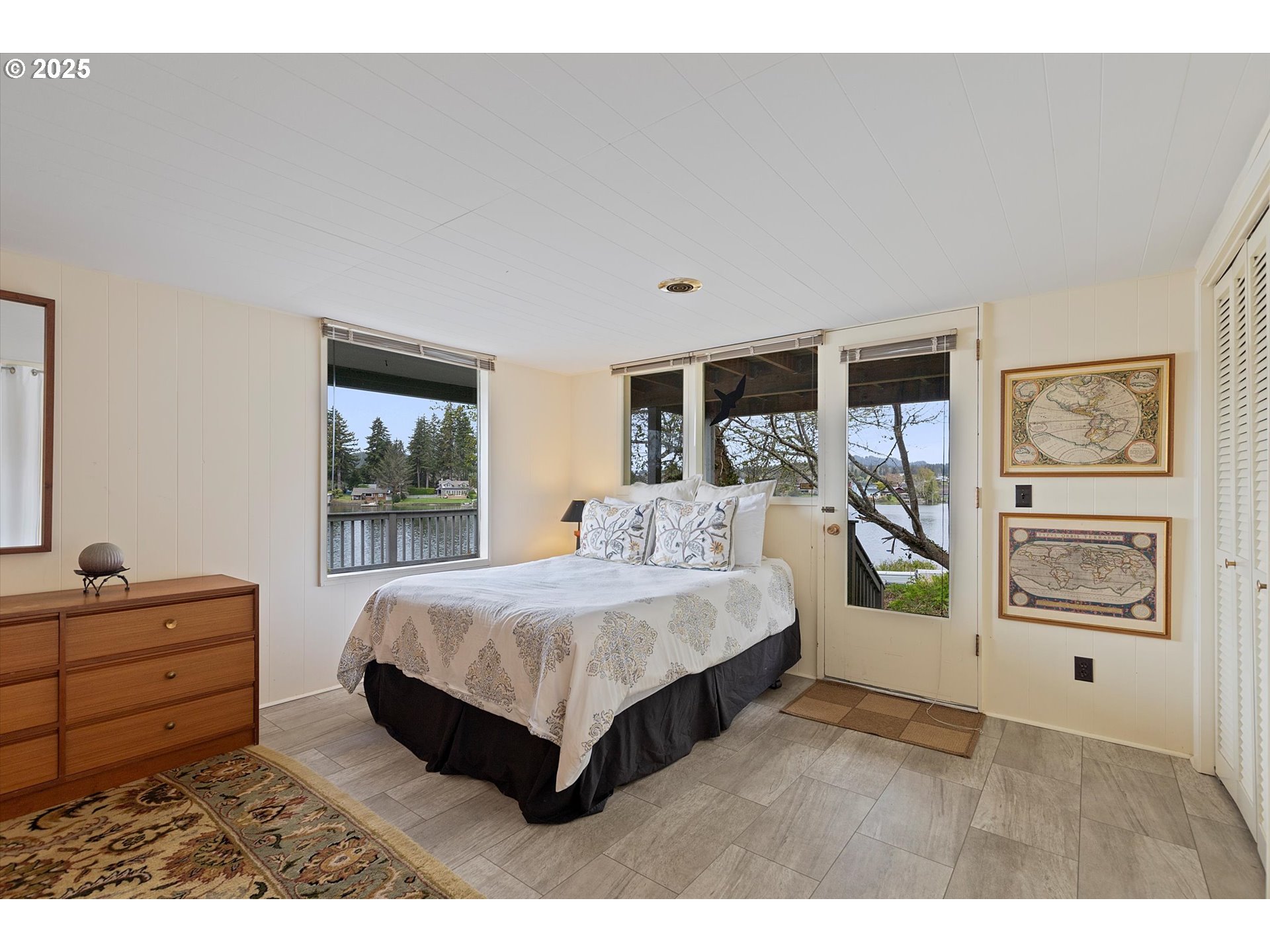 2871 Northeast East Devils Lake Road Otis, OR 97368 - Photo 22 of 48 a living room with furniture and a dresser