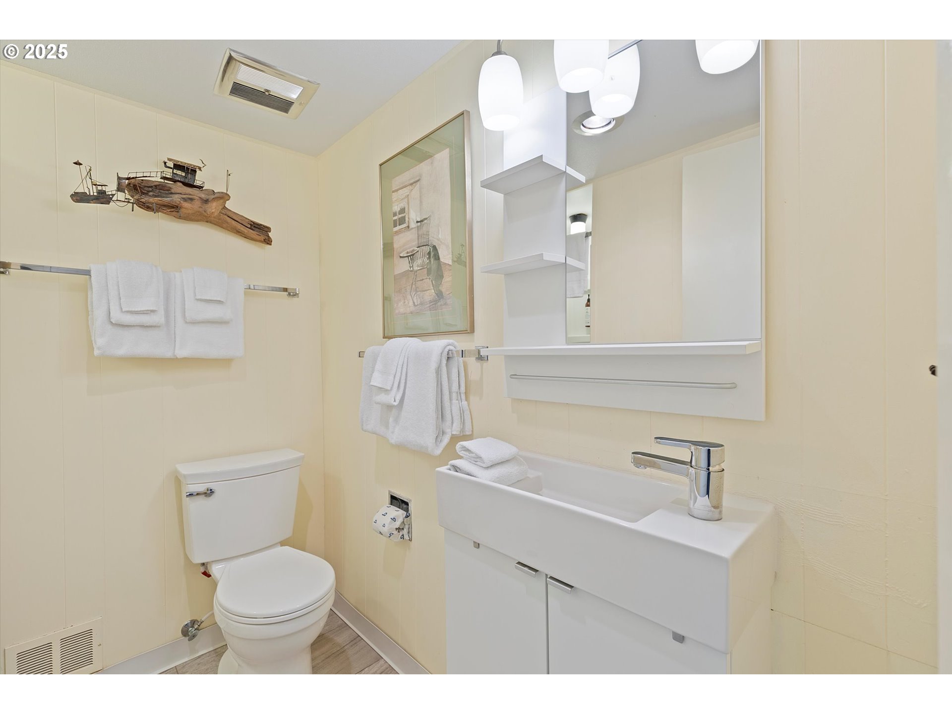 2871 Northeast East Devils Lake Road Otis, OR 97368 - Photo 25 of 48 a bathroom with a sink vanity mirror and toilet