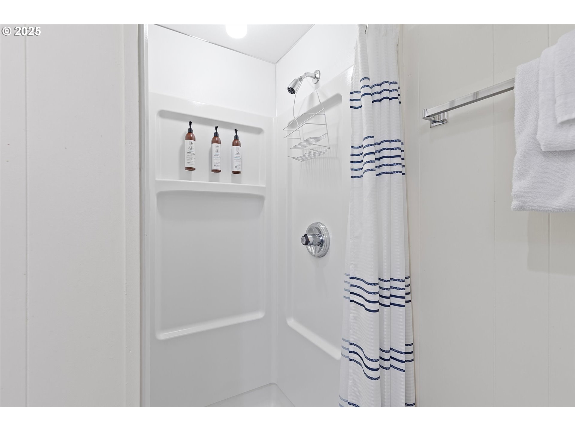 2871 Northeast East Devils Lake Road Otis, OR 97368 - Photo 26 of 48 a bathroom with a bathtub and shower