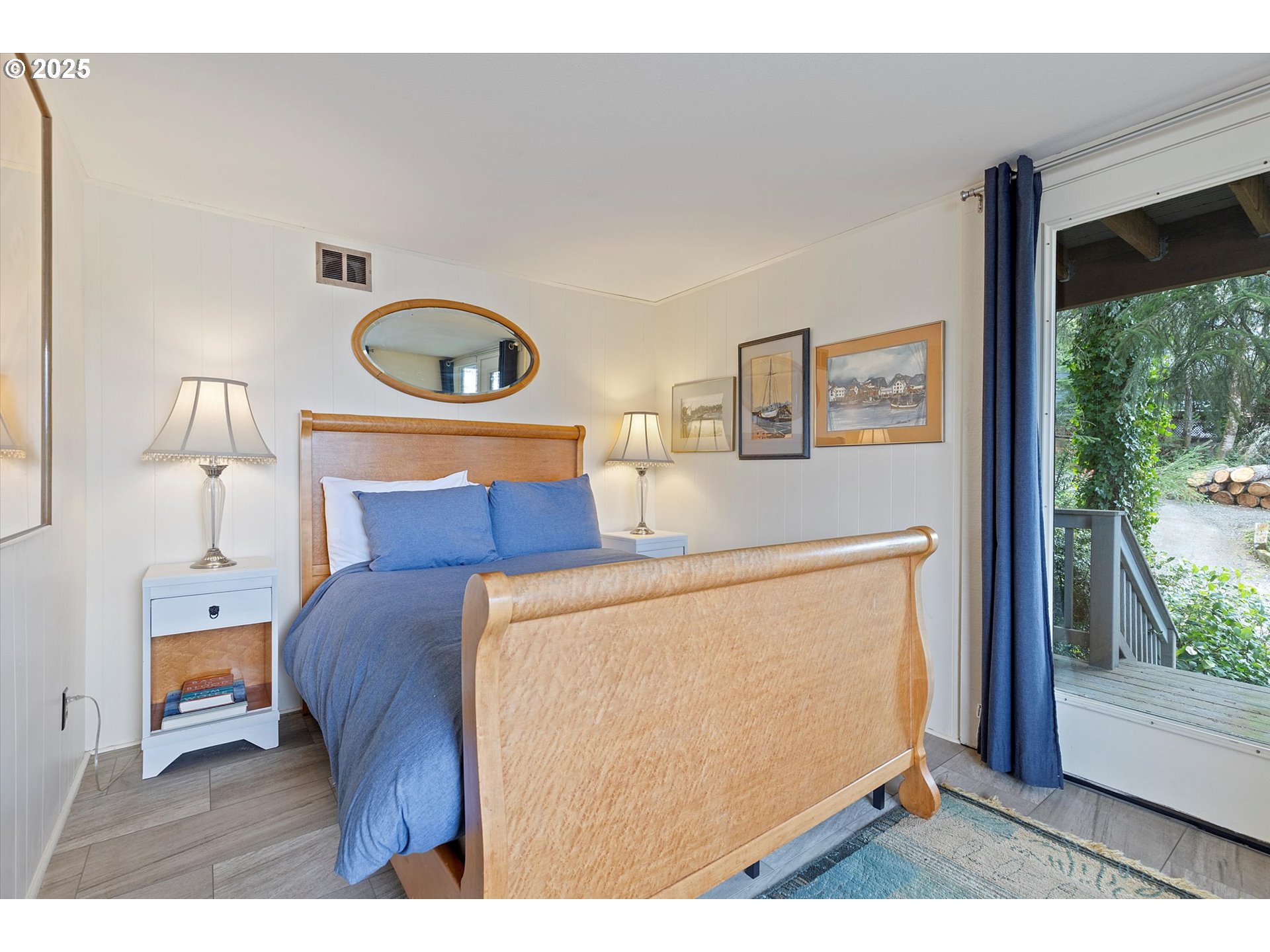 2871 Northeast East Devils Lake Road Otis, OR 97368 - Photo 29 of 48 a bedroom with a bed and a window