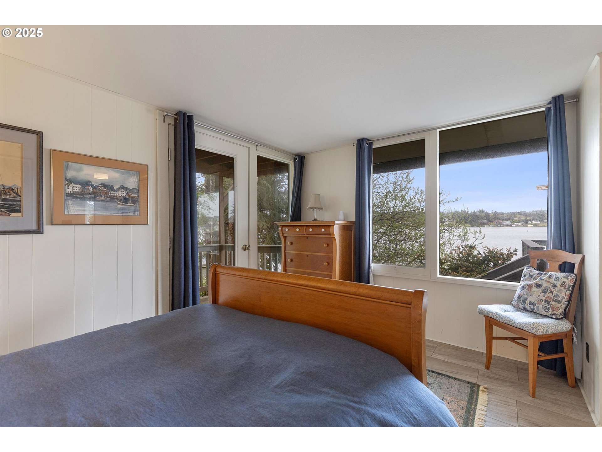 2871 Northeast East Devils Lake Road Otis, OR 97368 - Photo 30 of 48 a living room with furniture and a large window