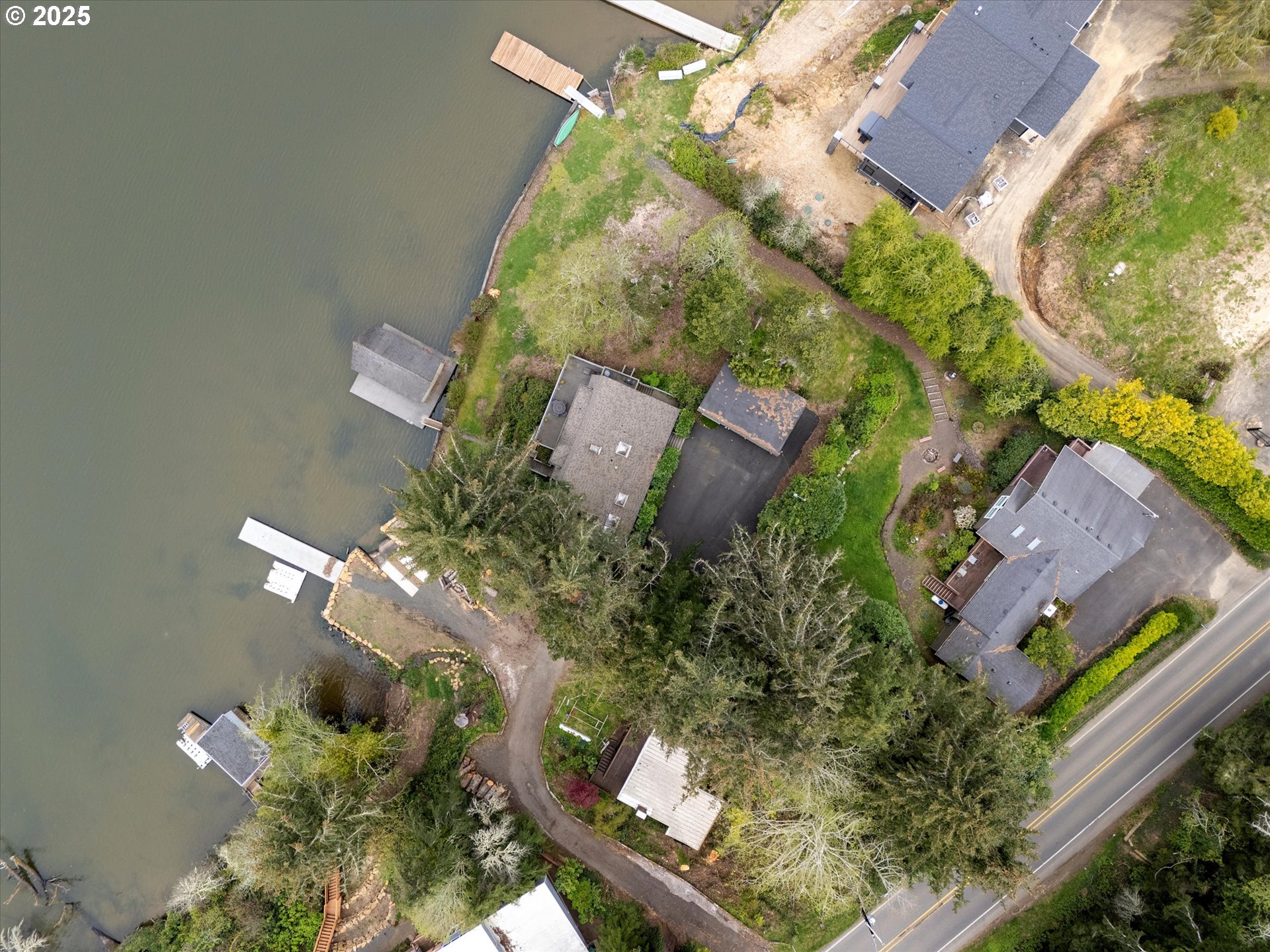2871 Northeast East Devils Lake Road Otis, OR 97368 - Photo 39 of 48 an aerial view of a house a yard and a garden