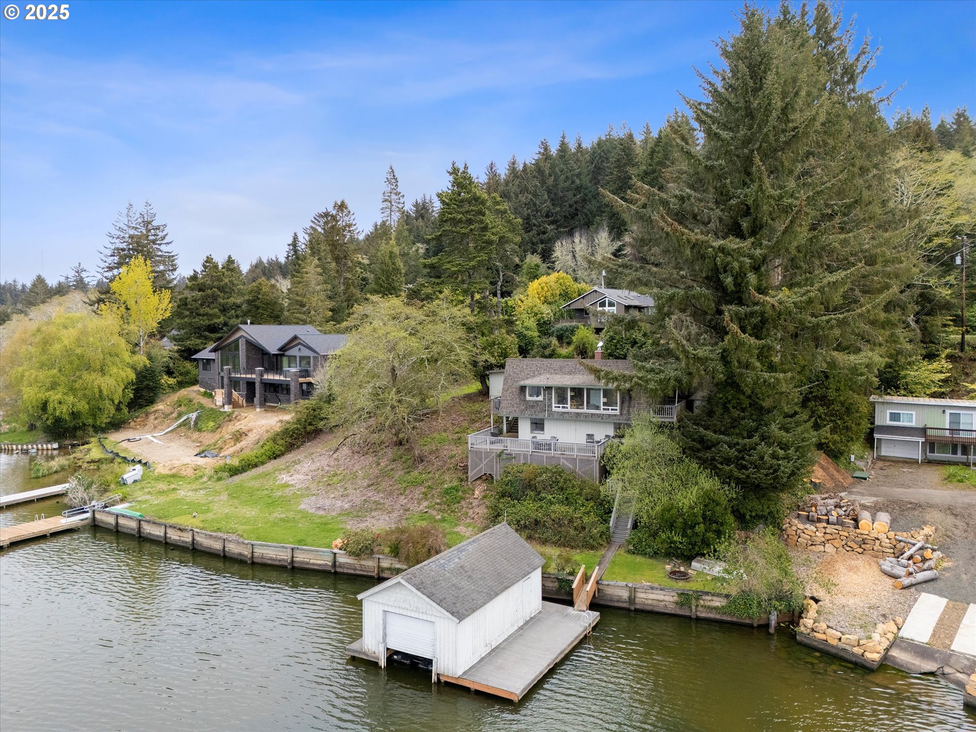 2871 Northeast East Devils Lake Road Otis, OR 97368 - Photo 41 of 48 an aerial view of a house with a yard basket ball court and outdoor seating