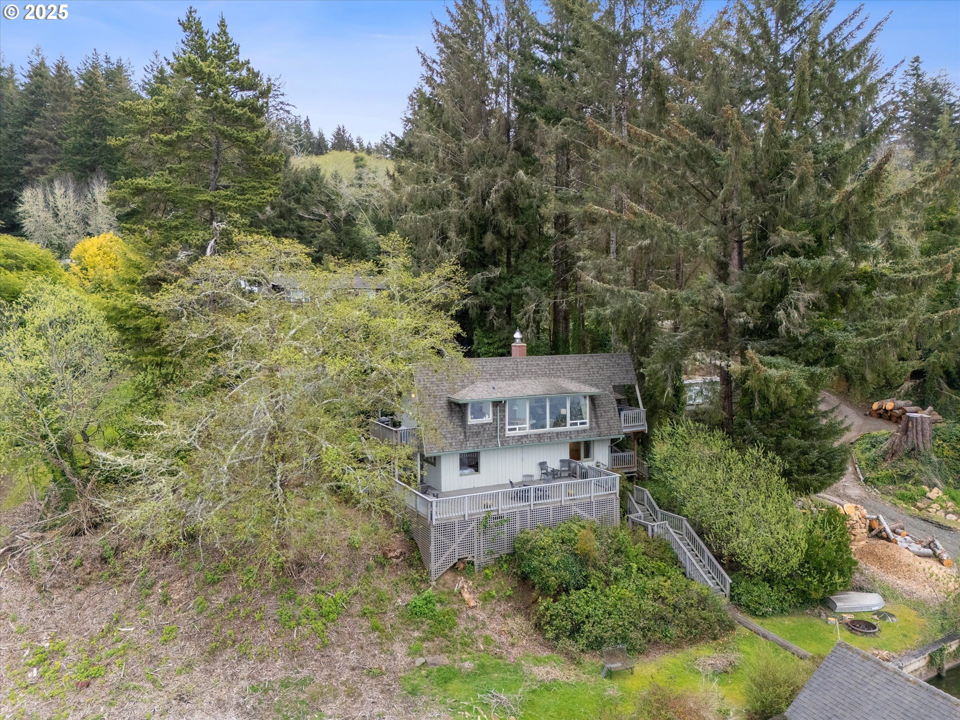 2871 Northeast East Devils Lake Road Otis, OR 97368 - Photo 42 of 48 aerial view of a house with a yard