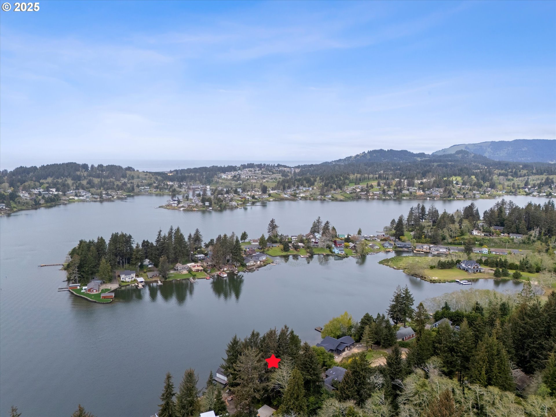 2871 Northeast East Devils Lake Road Otis, OR 97368 - Photo 44 of 48 a view of a city with lake