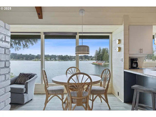 a kitchen with a table and chairs in it