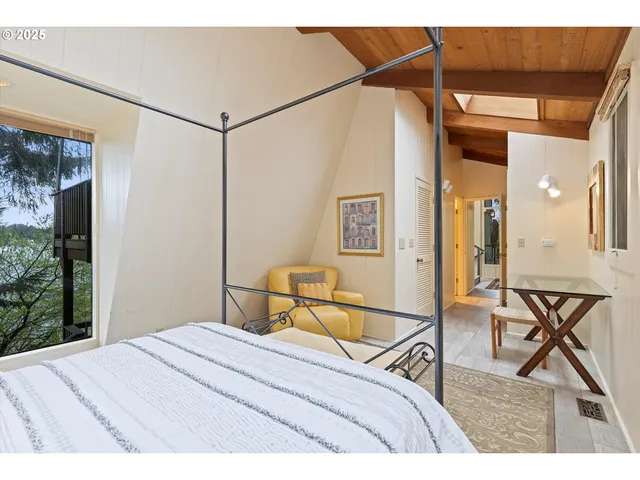 a kitchen with refrigerator and cabinets