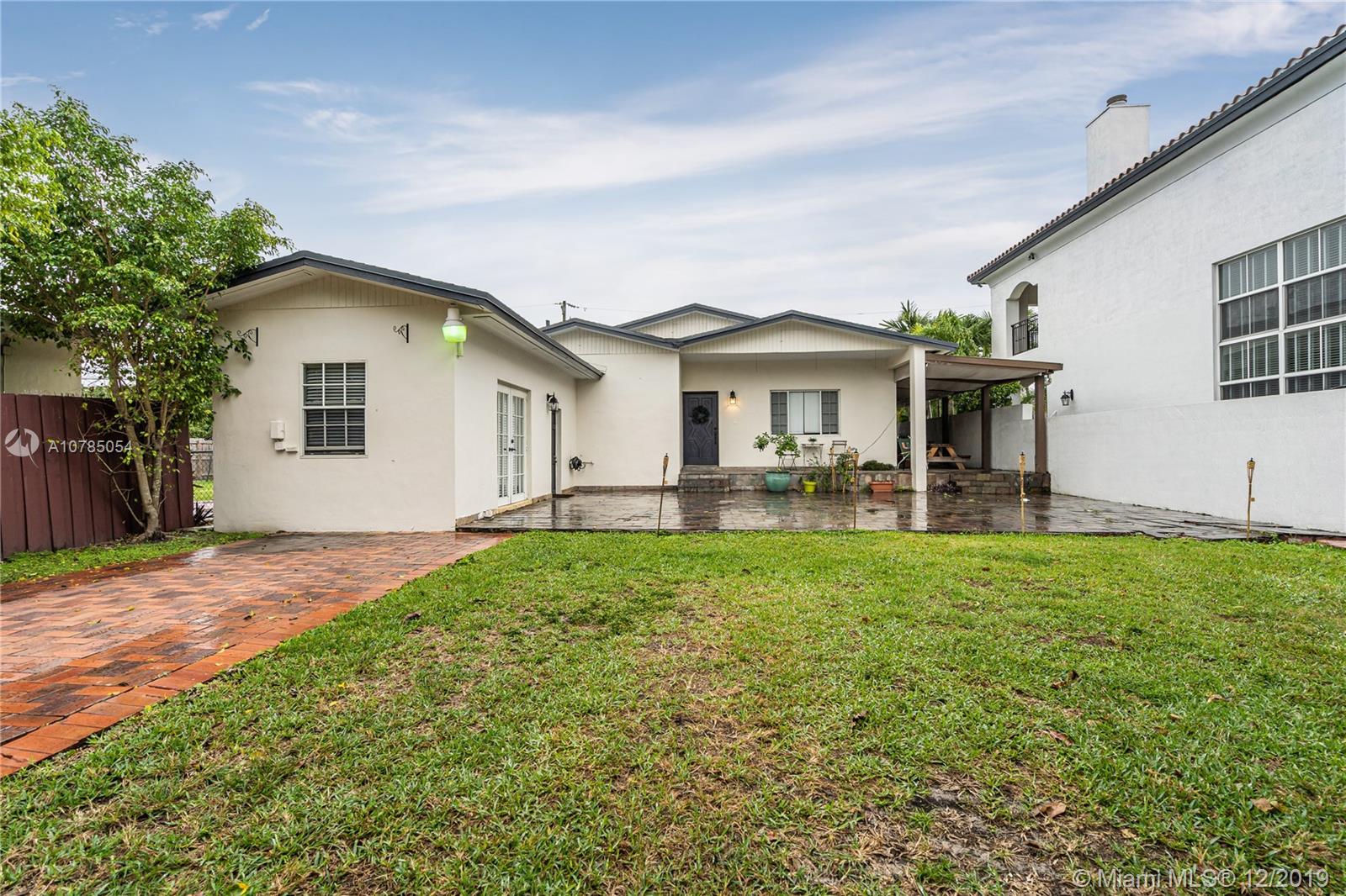 6342 Southwest 23rd Street Miami, FL 33155 - Photo 1 of 37 Exterior front- huge front yard