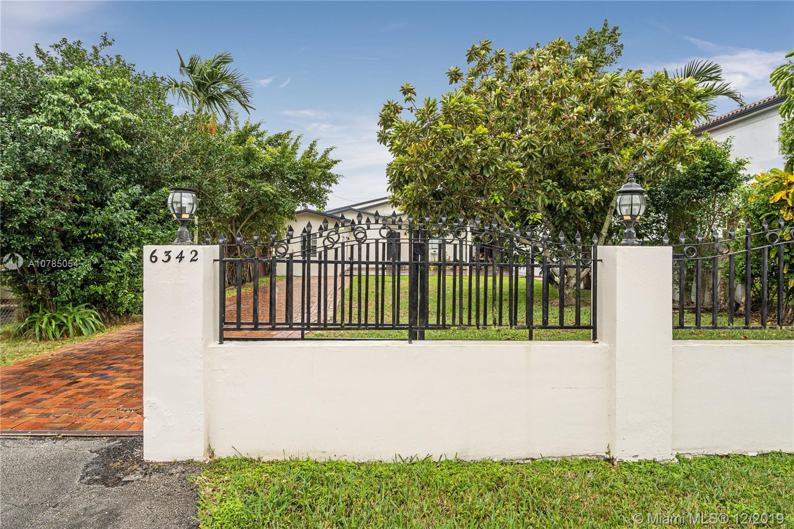 6342 Southwest 23rd Street Miami, FL 33155 - Photo 4 of 37 automatic gate.