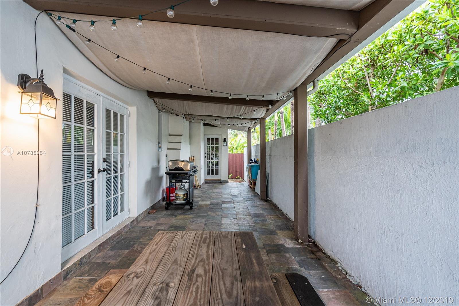 6342 Southwest 23rd Street Miami, FL 33155 - Photo 9 of 37 access to terrace from living and kitchen doors.