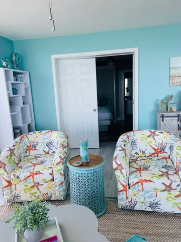 a bedroom with a bed and a couch