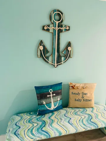 a bedroom with a bed and a painting on the wall