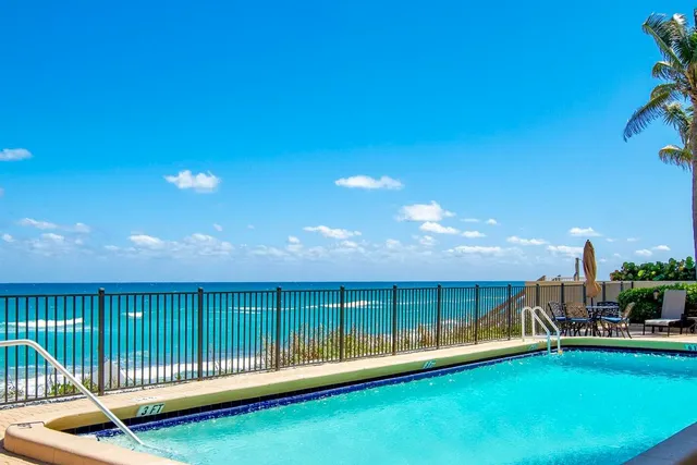 a kitchen with stainless steel appliances a refrigerator stove microwave and sink