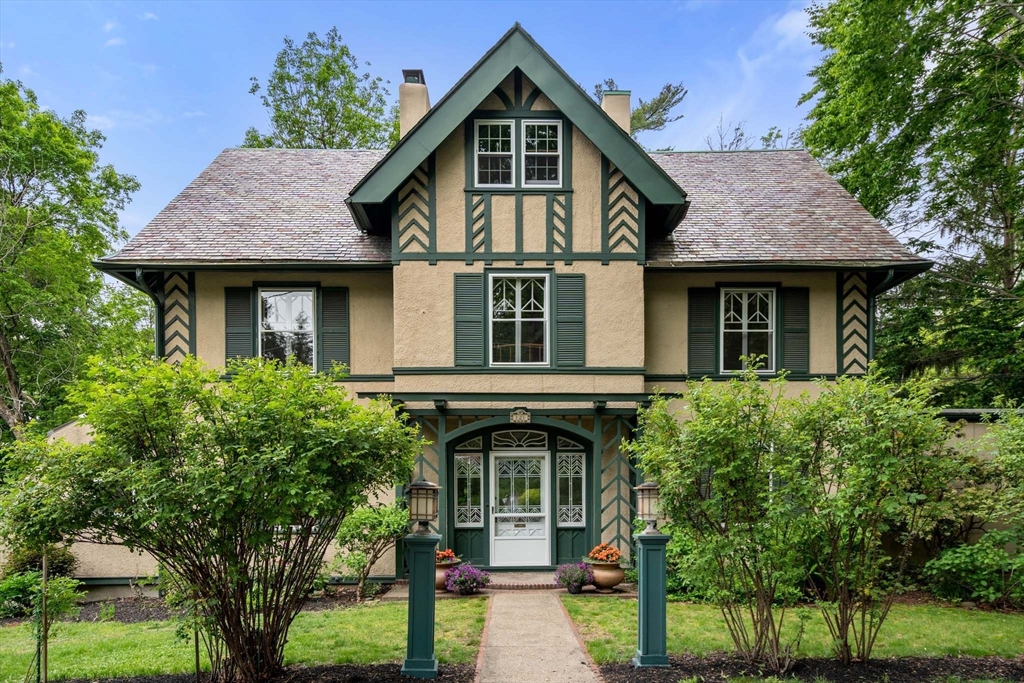 121 Bishopsgate Road Newton, MA 02459 - Photo 1 of 34 a front view of a house with garden
