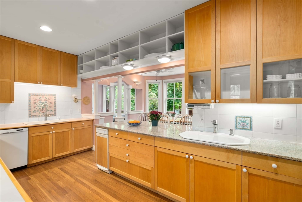 121 Bishopsgate Road Newton, MA 02459 - Photo 11 of 34 a kitchen with a sink windows and cabinets