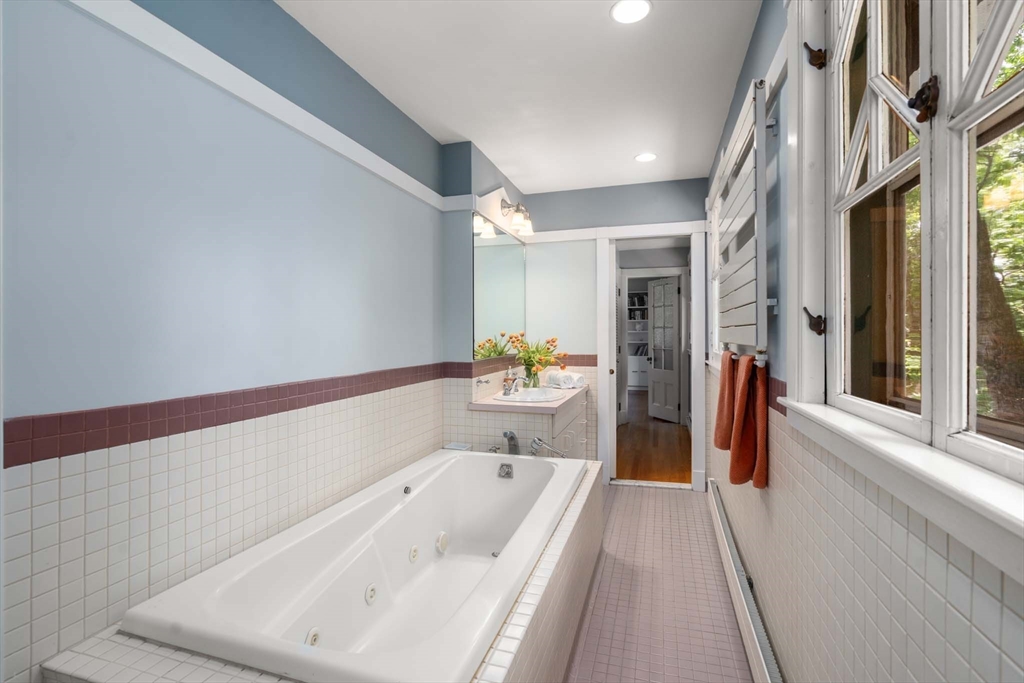 121 Bishopsgate Road Newton, MA 02459 - Photo 19 of 34 a spacious bathroom with a tub and shower