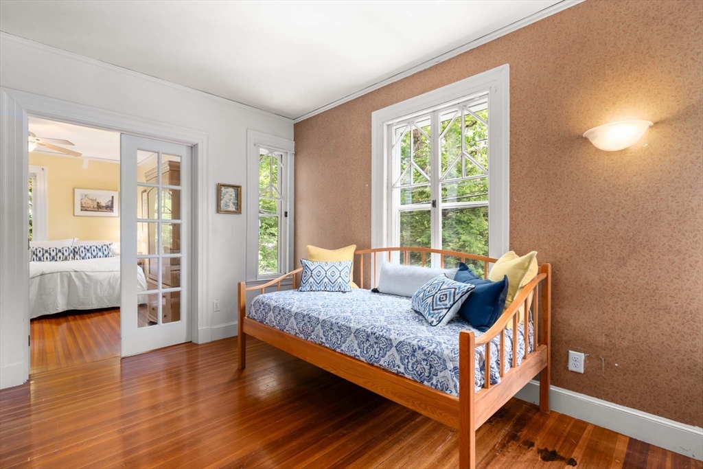 121 Bishopsgate Road Newton, MA 02459 - Photo 20 of 34 a bedroom with a bed and wooden floor