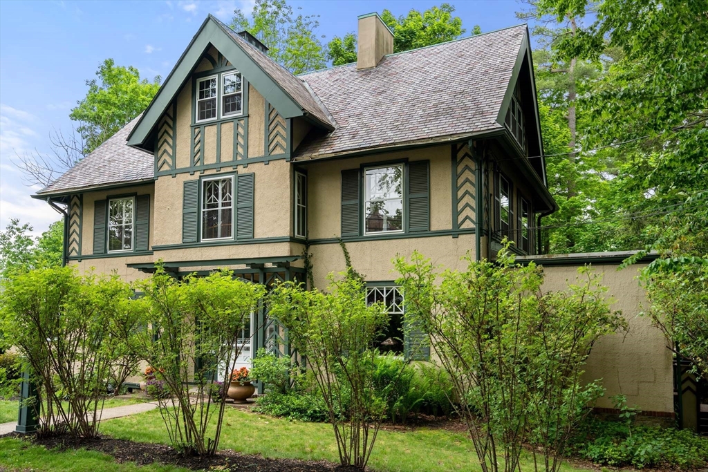121 Bishopsgate Road Newton, MA 02459 - Photo 2 of 34 a front view of a house with a yard