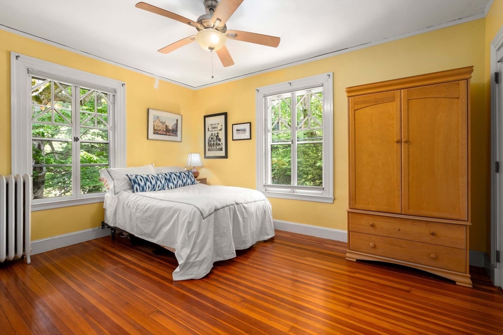 121 Bishopsgate Road Newton, MA 02459 - Photo 21 of 34 a bedroom with a bed and wooden floor