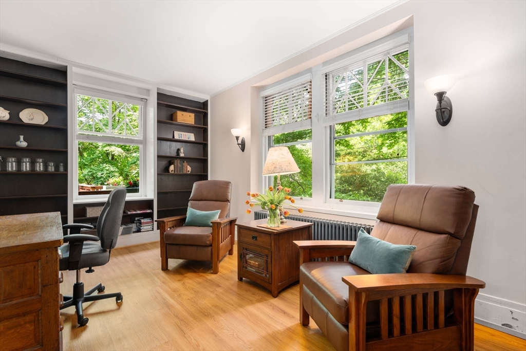 121 Bishopsgate Road Newton, MA 02459 - Photo 22 of 34 a living room with furniture and a floor to ceiling window
