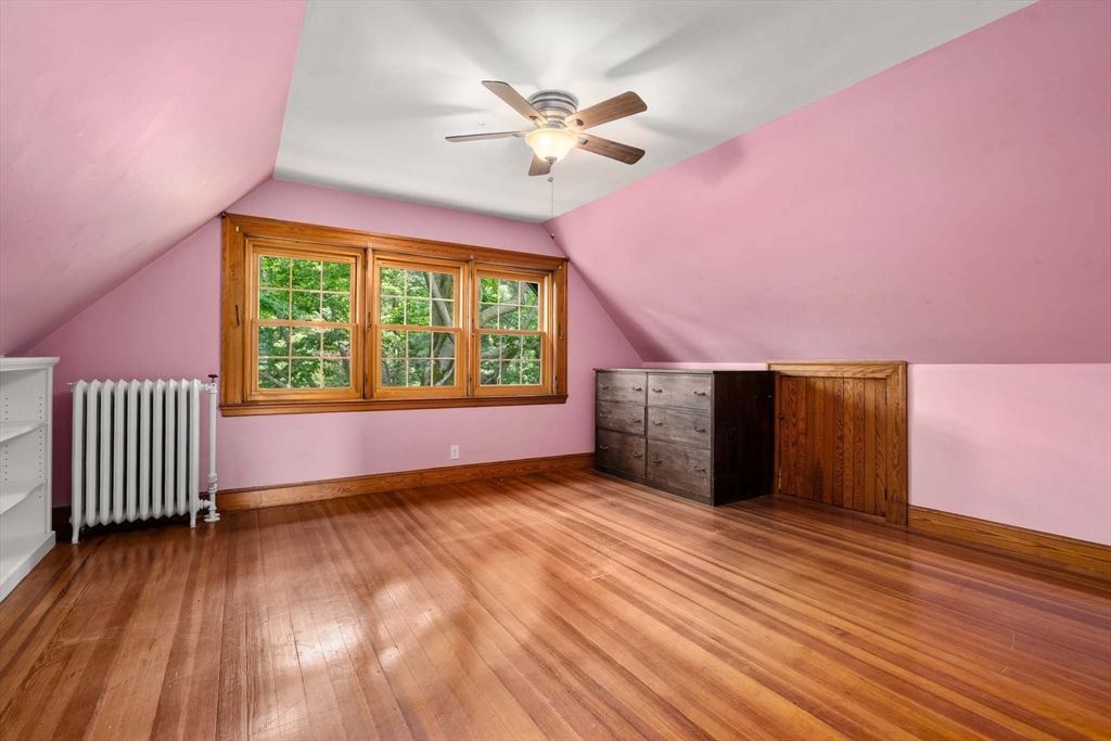 121 Bishopsgate Road Newton, MA 02459 - Photo 23 of 34 a view of an empty room with a window and wooden floor