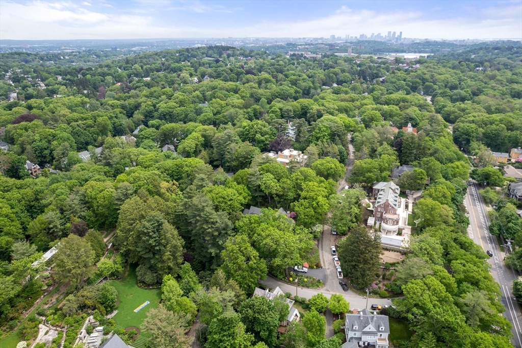 121 Bishopsgate Road Newton, MA 02459 - Photo 33 of 34 an aerial view of a city with lots of residential buildings and mountain view in back