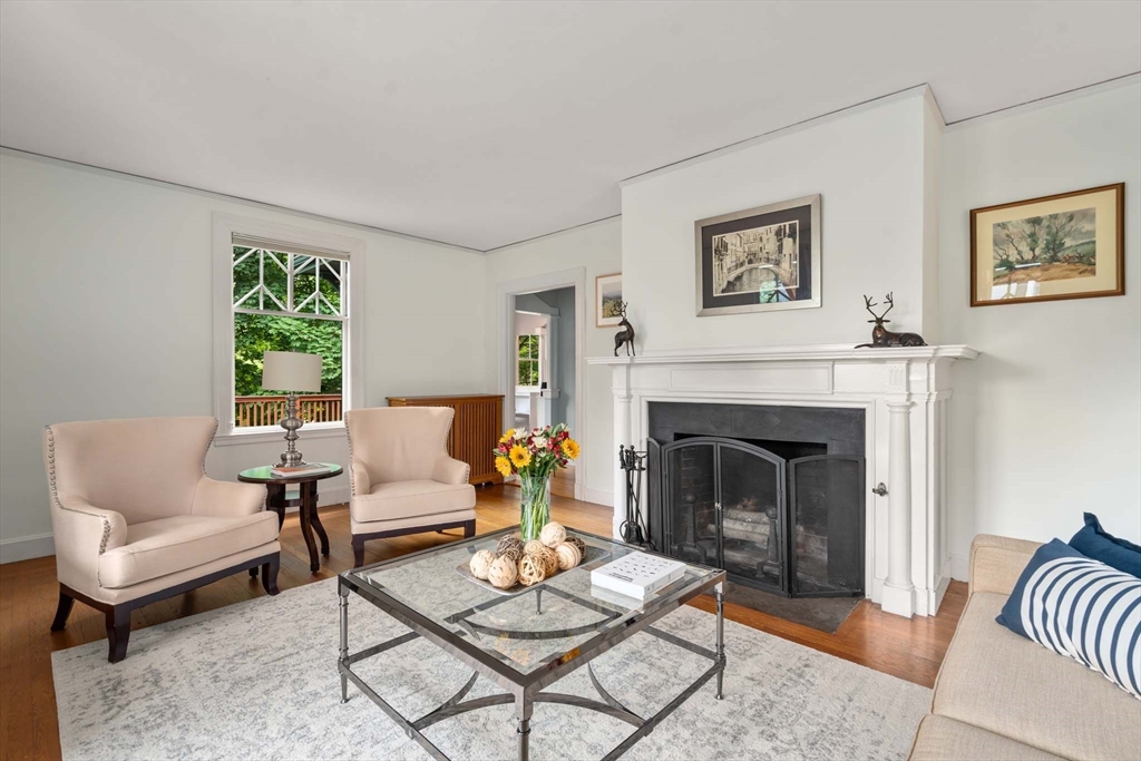 121 Bishopsgate Road Newton, MA 02459 - Photo 6 of 34 a living room with furniture and a fireplace