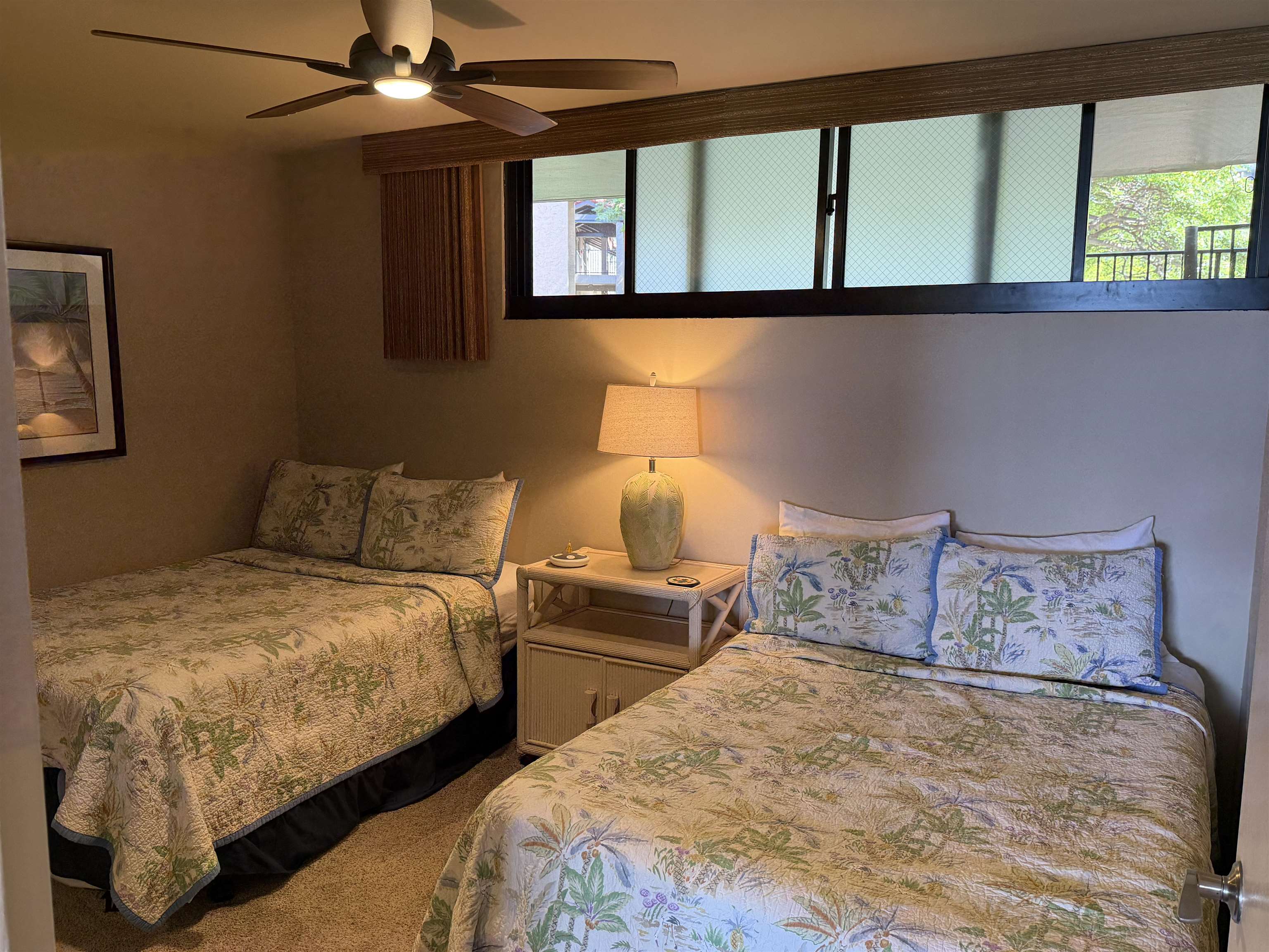 3543 Lower Honoapiilani Road, Unit L202 Lahaina, HI 96761 - Photo 14 of 22 a bedroom with two beds and a window