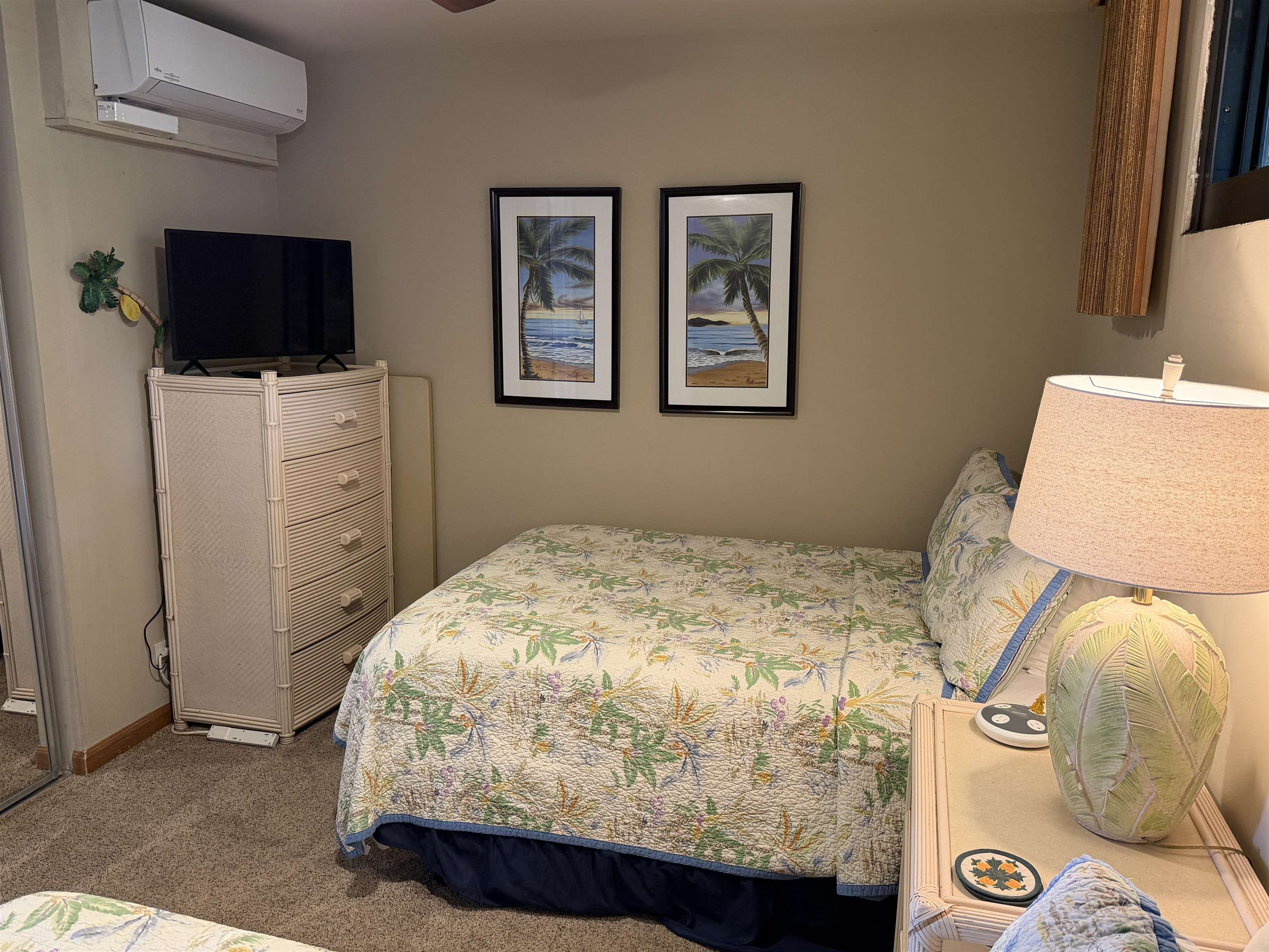 3543 Lower Honoapiilani Road, Unit L202 Lahaina, HI 96761 - Photo 15 of 22 a bedroom with a bed and flat screen tv