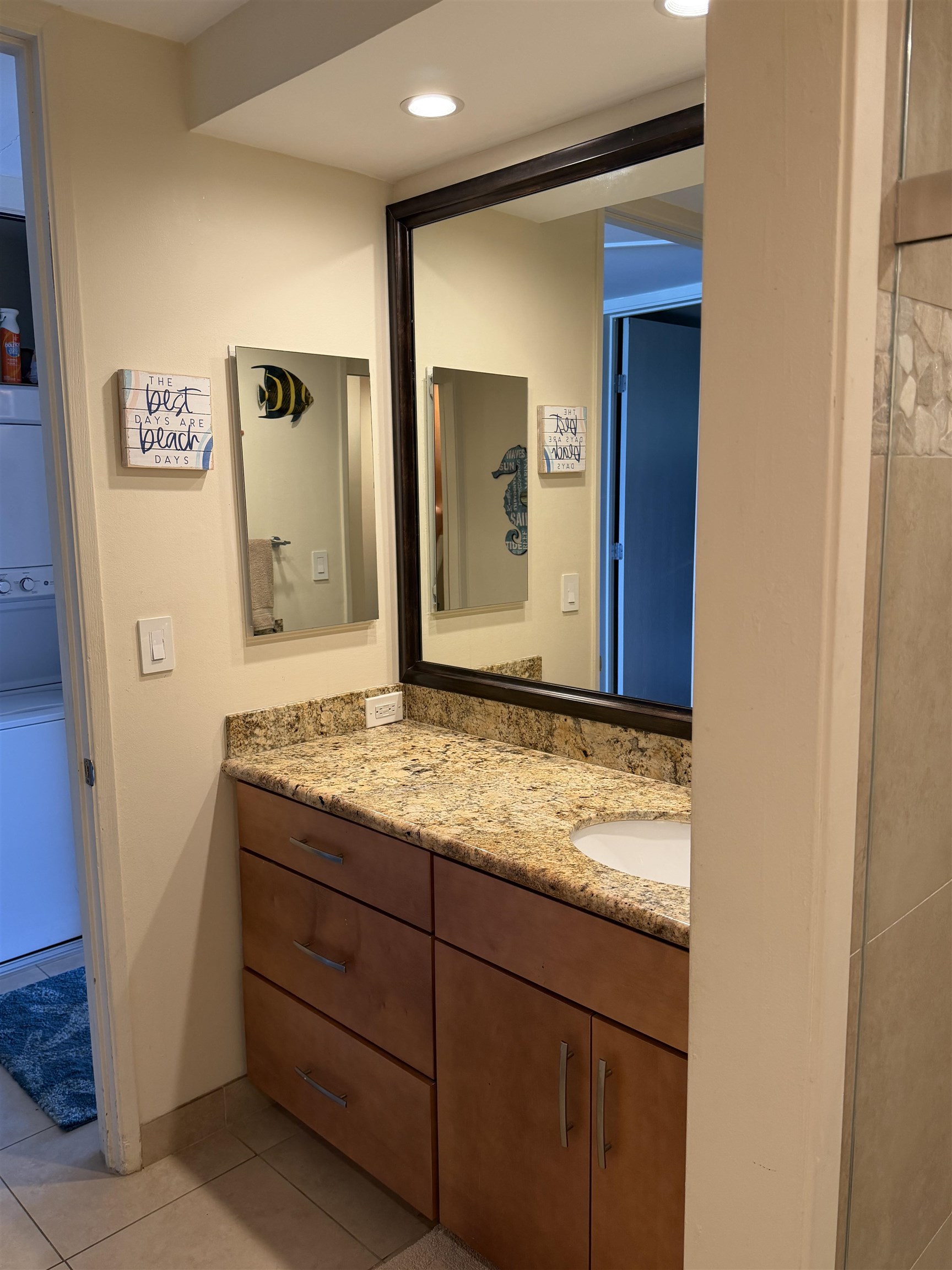 3543 Lower Honoapiilani Road, Unit L202 Lahaina, HI 96761 - Photo 17 of 22 a bathroom with a granite countertop sink and a mirror