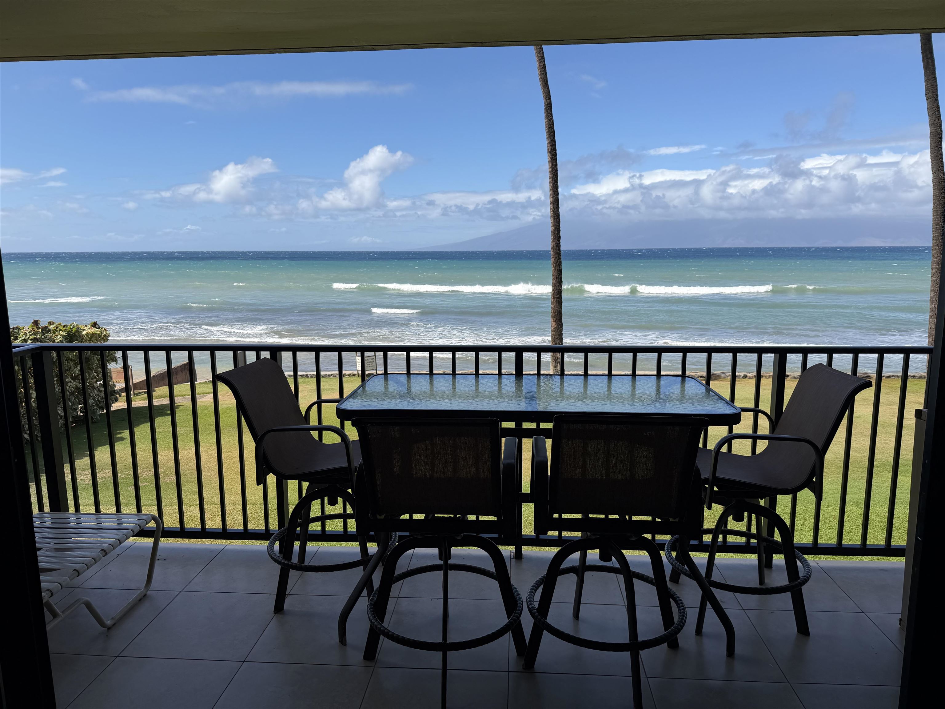 3543 Lower Honoapiilani Road, Unit L202 Lahaina, HI 96761 - Photo 21 of 22 a view of a chairs and table in patio