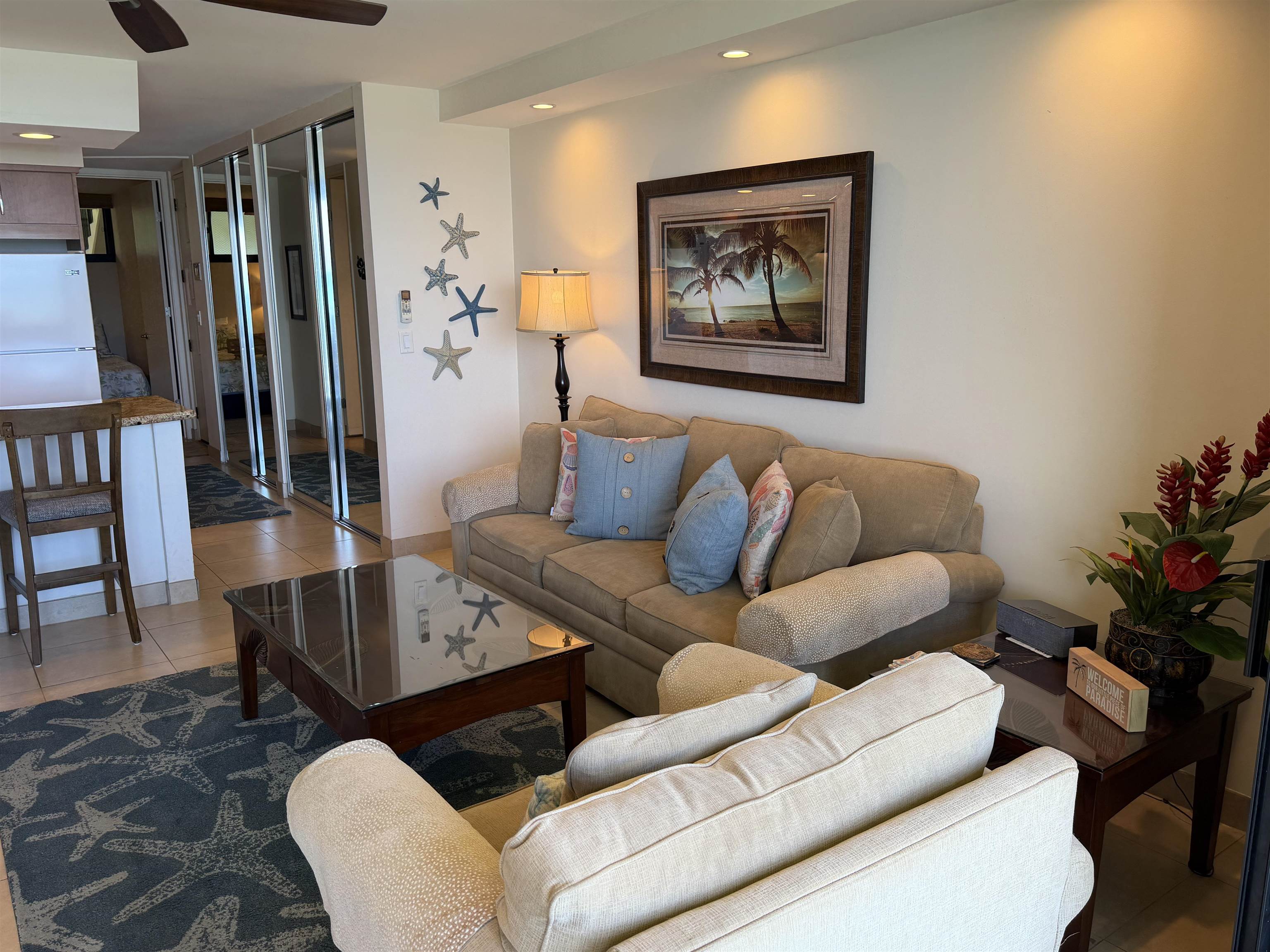 3543 Lower Honoapiilani Road, Unit L202 Lahaina, HI 96761 - Photo 3 of 22 a living room with furniture potted plant and a table
