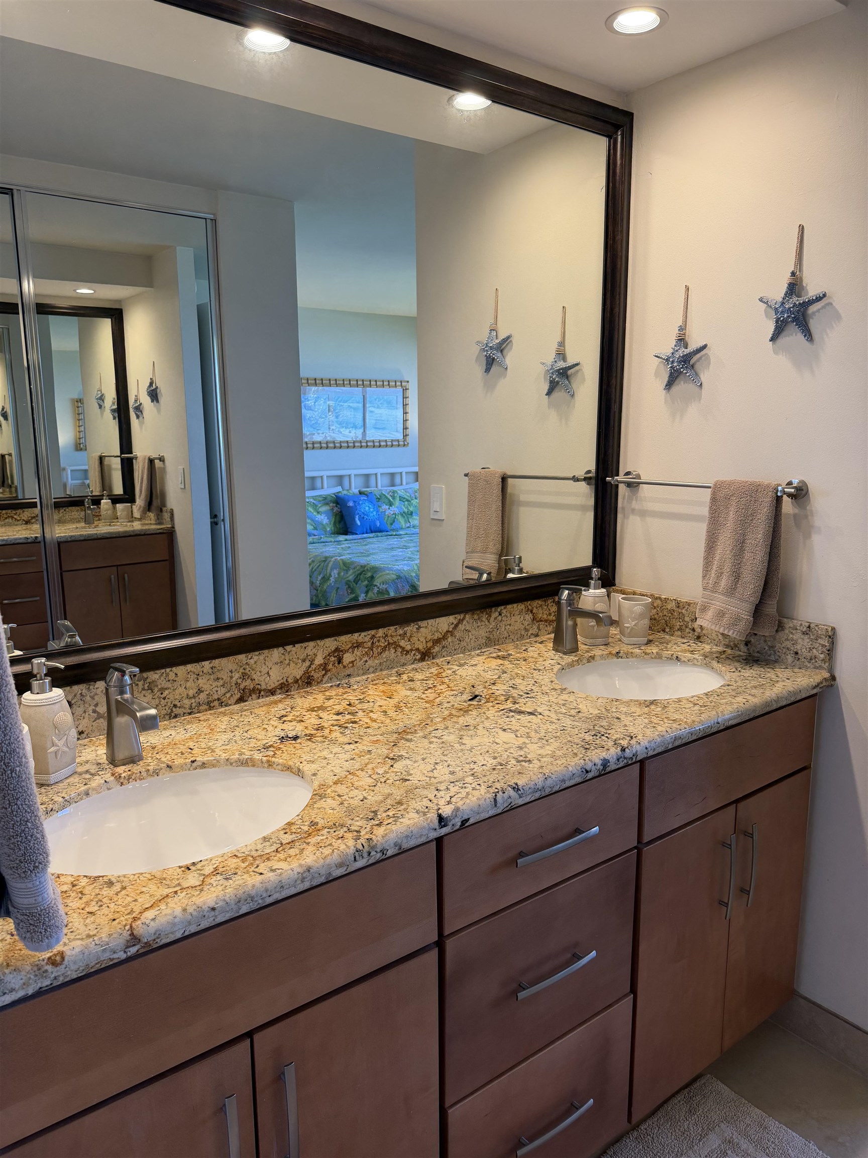 3543 Lower Honoapiilani Road, Unit L202 Lahaina, HI 96761 - Photo 9 of 22 a bathroom with a granite countertop sink and a mirror