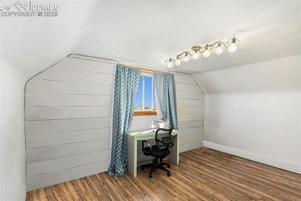 2905 Lauppe Road Yoder, CO 80864 - Photo 12 of 34 a view of a room with wooden floor and lounge chair