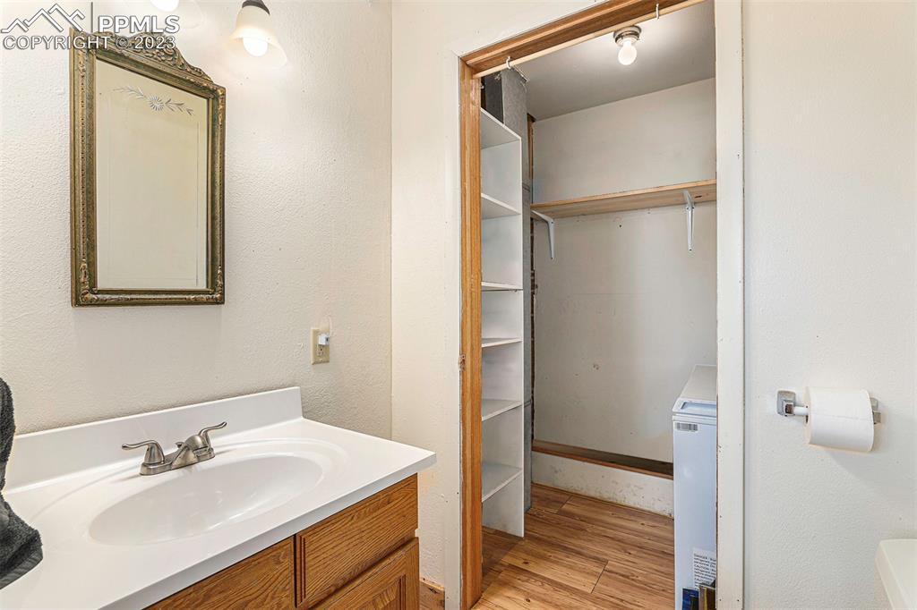 2905 Lauppe Road Yoder, CO 80864 - Photo 13 of 34 a bathroom with a sink and a mirror