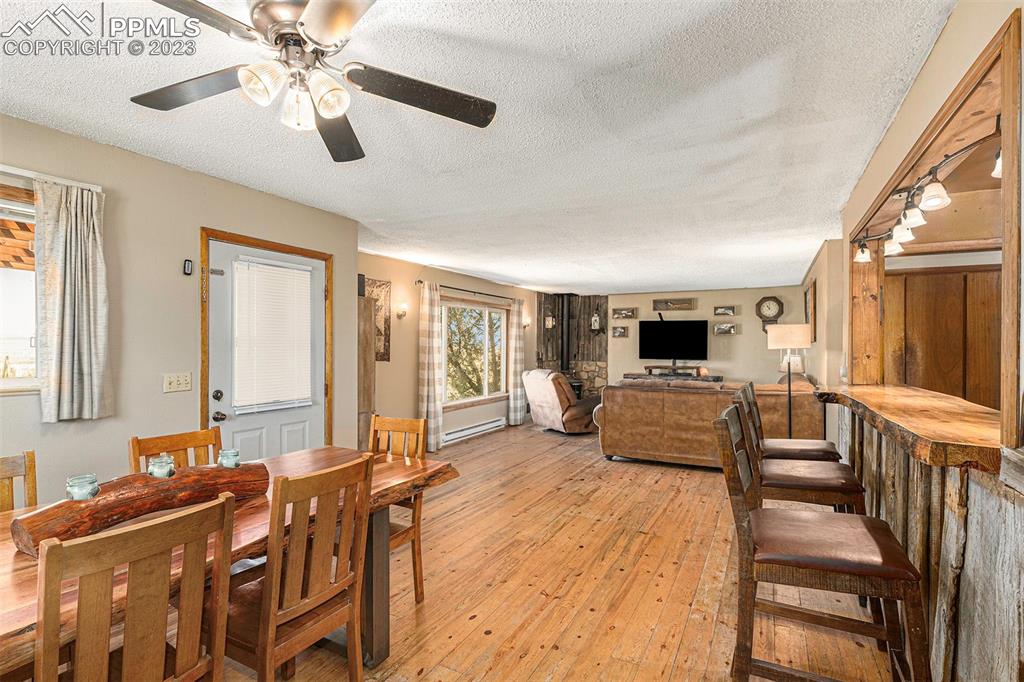 2905 Lauppe Road Yoder, CO 80864 - Photo 16 of 34 a living room with furniture and a flat screen tv