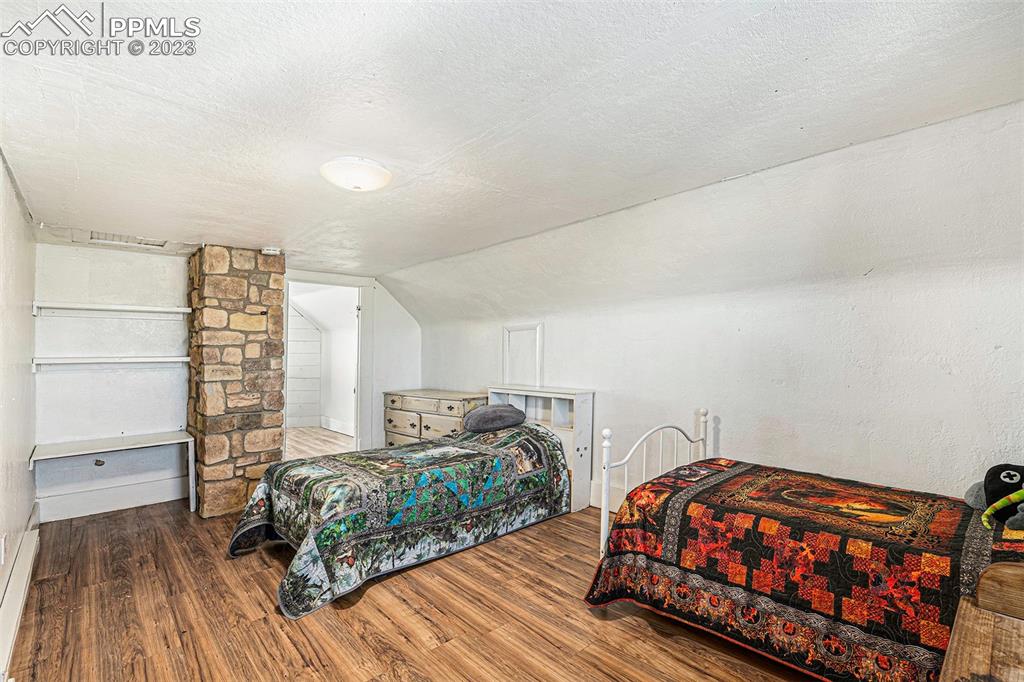 2905 Lauppe Road Yoder, CO 80864 - Photo 19 of 34 a bedroom with a bed and a dresser