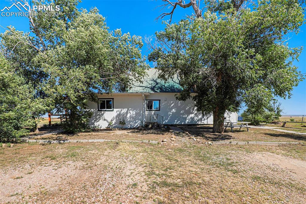 2905 Lauppe Road Yoder, CO 80864 - Photo 2 of 34 a view of a house with a yard