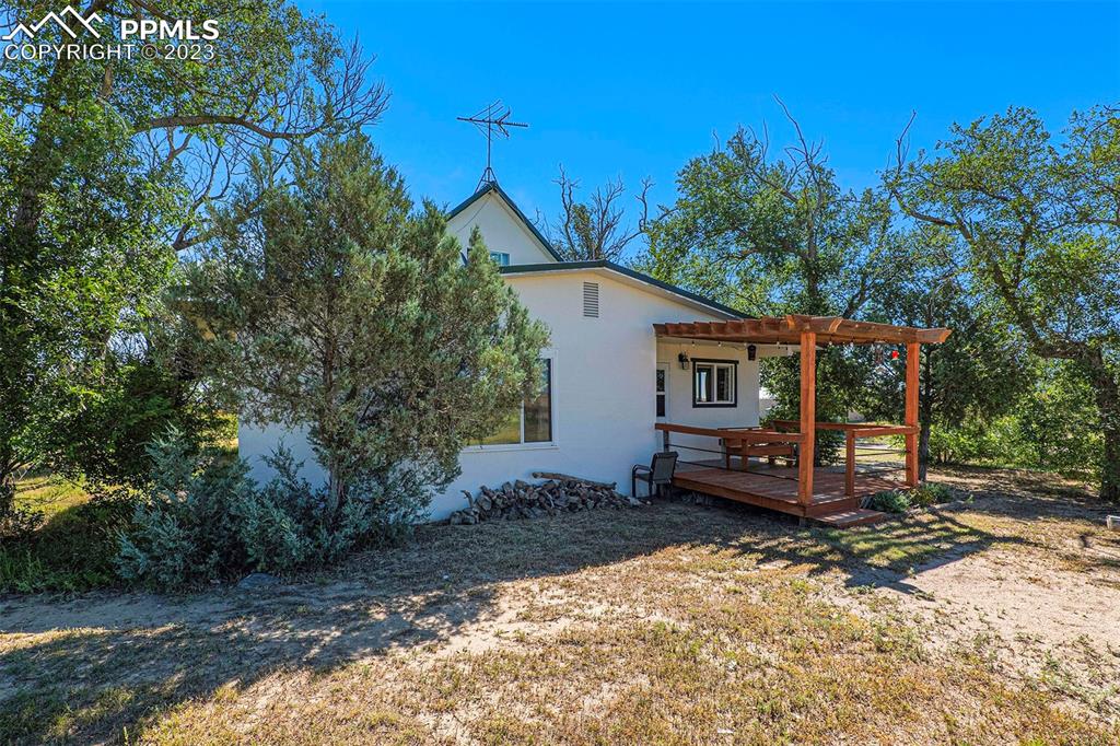 2905 Lauppe Road Yoder, CO 80864 - Photo 28 of 34 a front view of a house with a yard