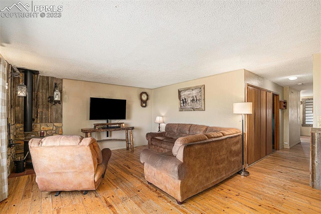 2905 Lauppe Road Yoder, CO 80864 - Photo 3 of 34 a living room with furniture and a flat screen tv