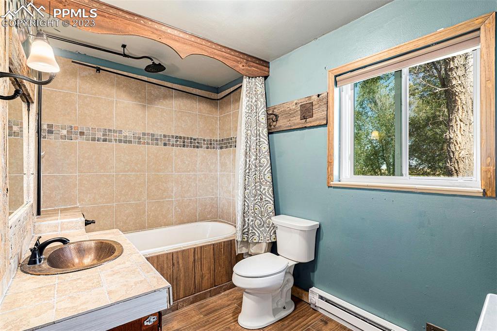 2905 Lauppe Road Yoder, CO 80864 - Photo 5 of 34 a bathroom with a sink toilet and shower